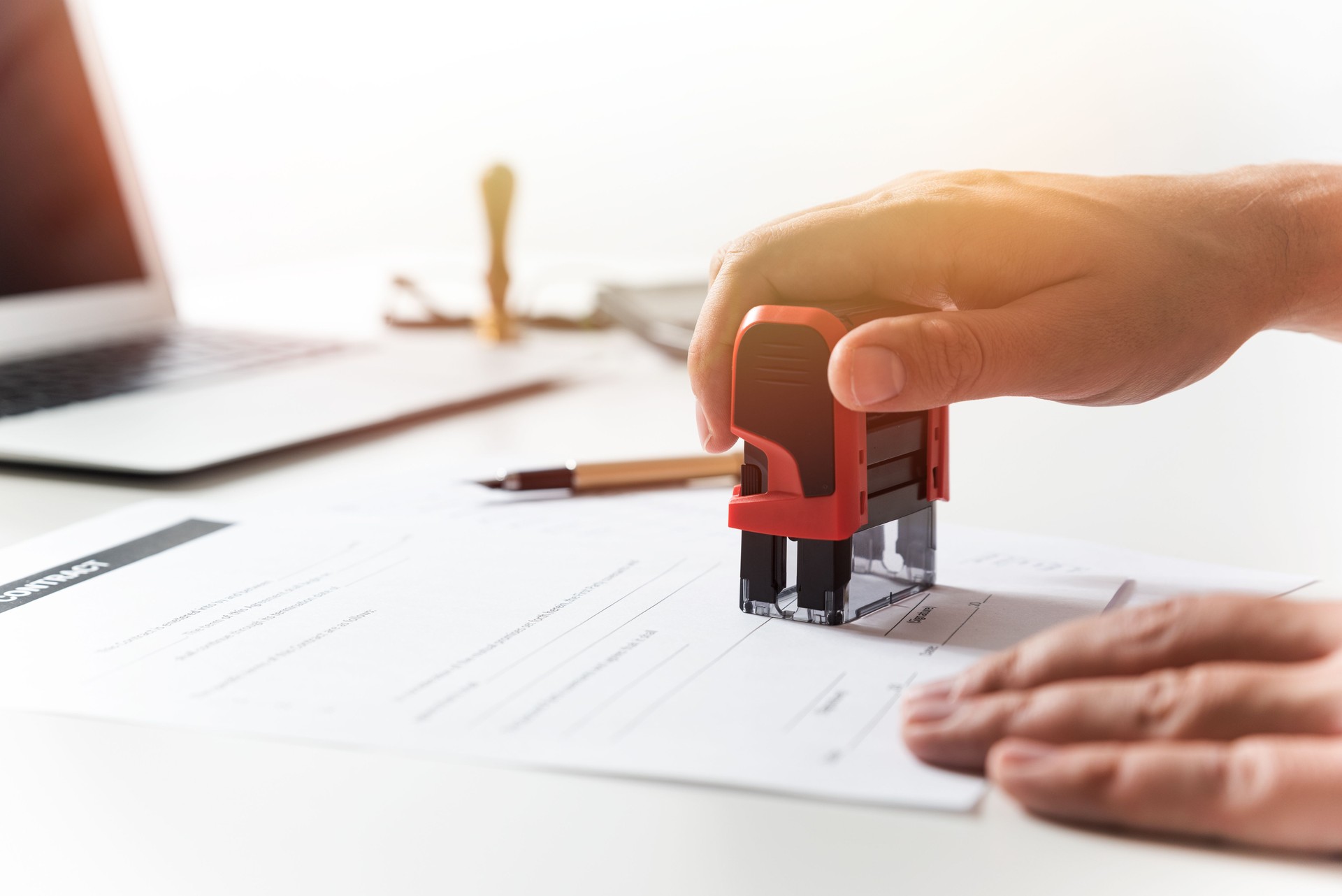 Lawyer working in office. Notary signs document